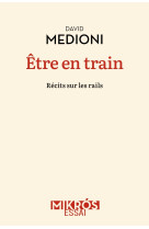 être en train